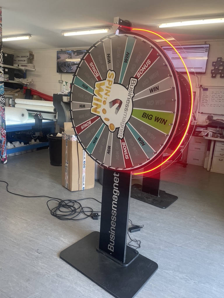 giant spin the wheel with neon halo